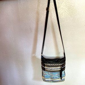 cross-body purse with blue flashlight keychain